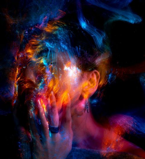 Silhouette of a person stretching against a warm, glowing background.